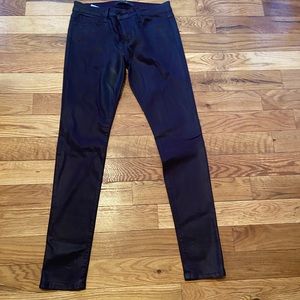 Mid rise, plum colored, coated skinny jeans